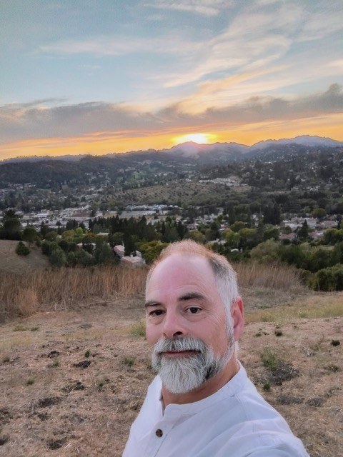 Bill Carman at sunset on the hill above Moraga Center